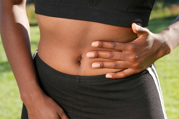 Woman's hand on her stomach